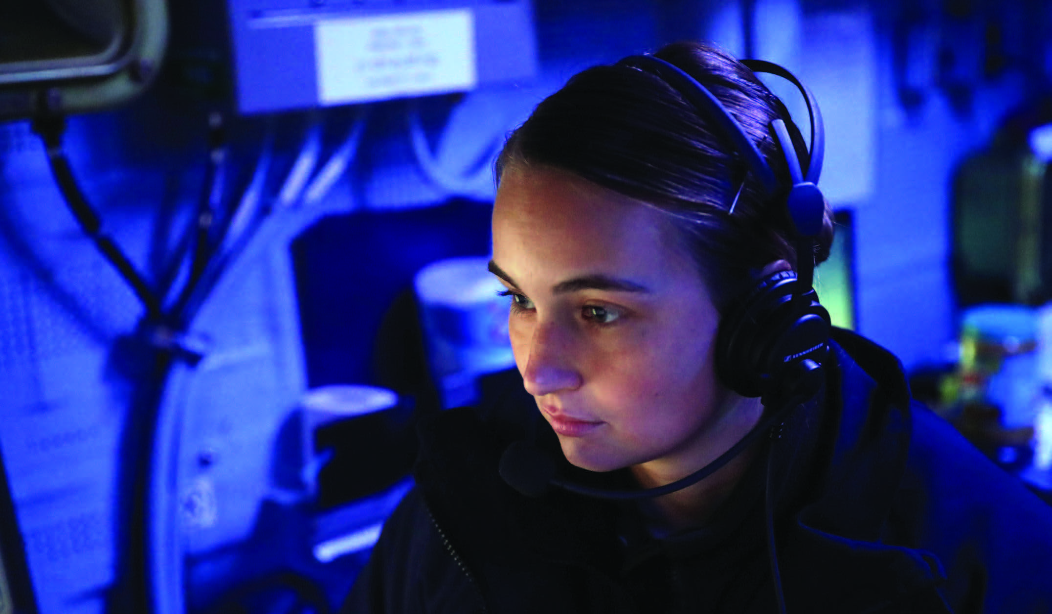 Cryptologic Technician Technical 2nd Class Hanna Baughman stands watch in combat information center aboard guided-missile destroyer USS Rafael Peralta, in Taiwan Strait, November 2, 2023 (U.S. Navy/Alexandria Esteban)